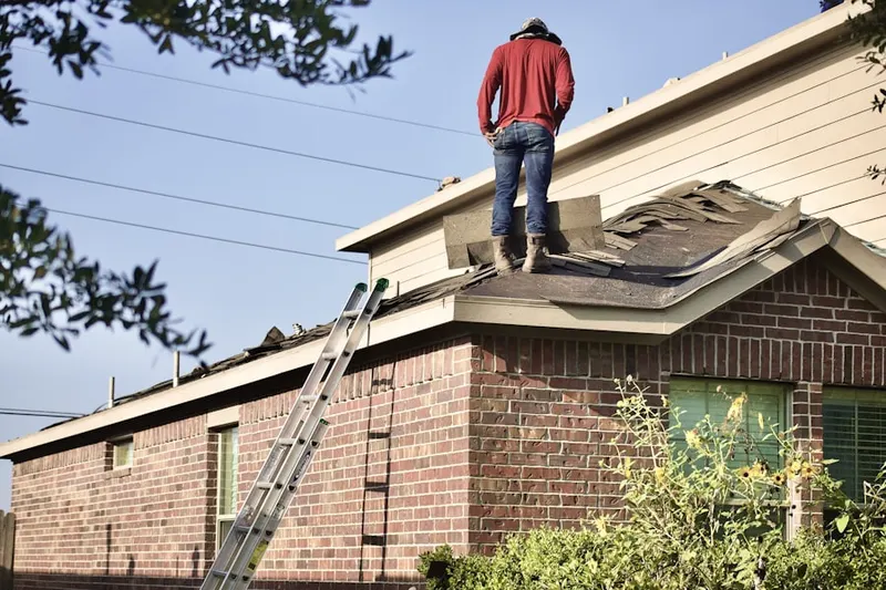 Professional roofer working on a residential roof in Tahoe Village